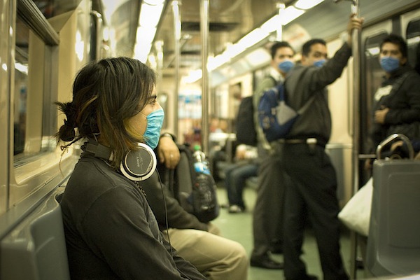 153771-Swine_Flu_Masked_Train_Passengers_in_Mexico_City